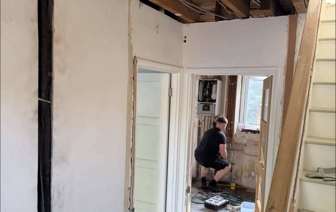 Plasterer skimming an interior wall