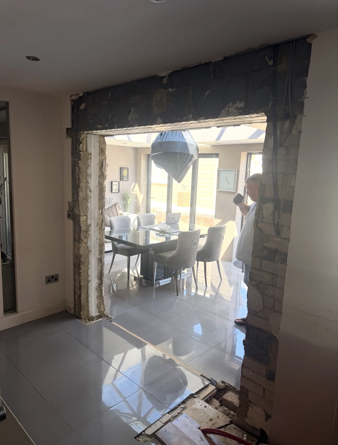 Before: structural opening formed between the kitchen and dining area