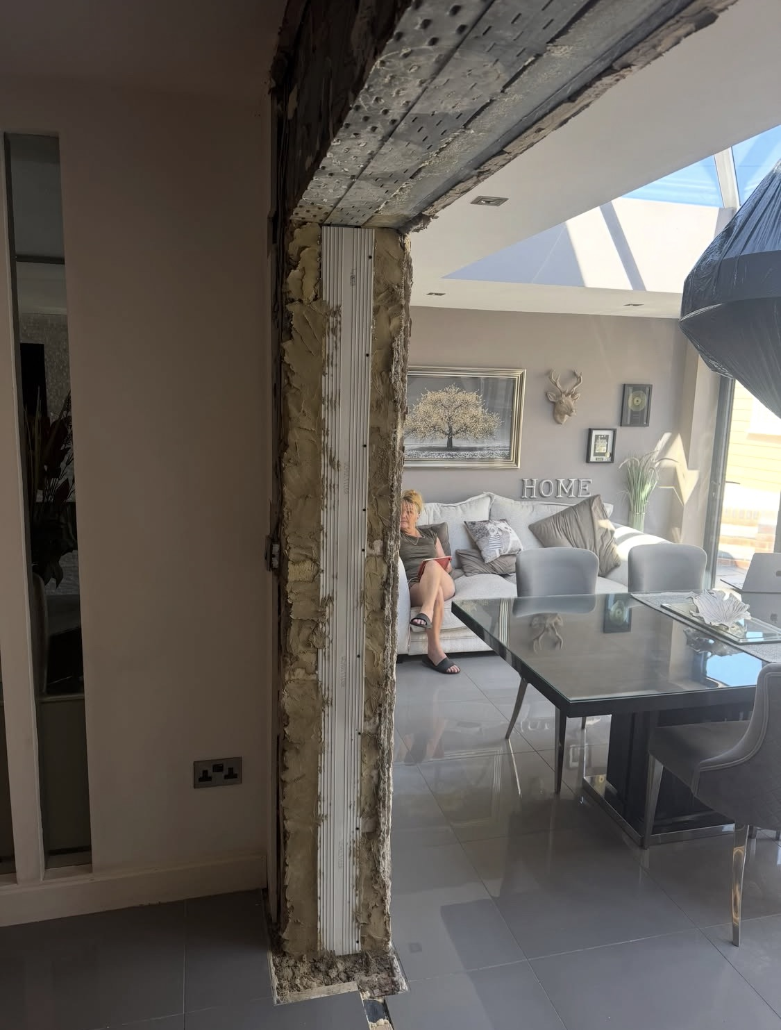 Before: exposed brickwork around the new opening through to the living room