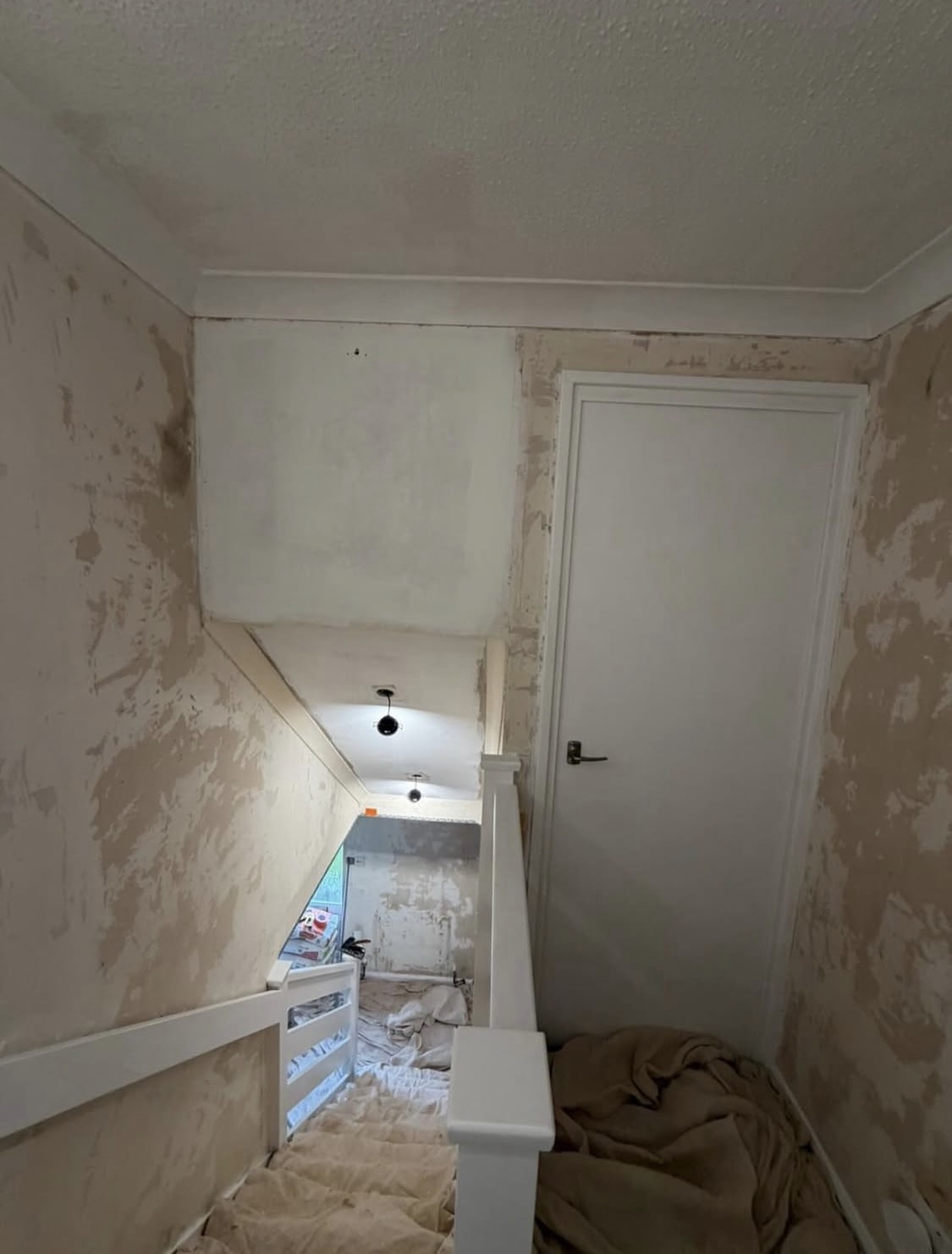 Before: landing stripped back ready for replastering