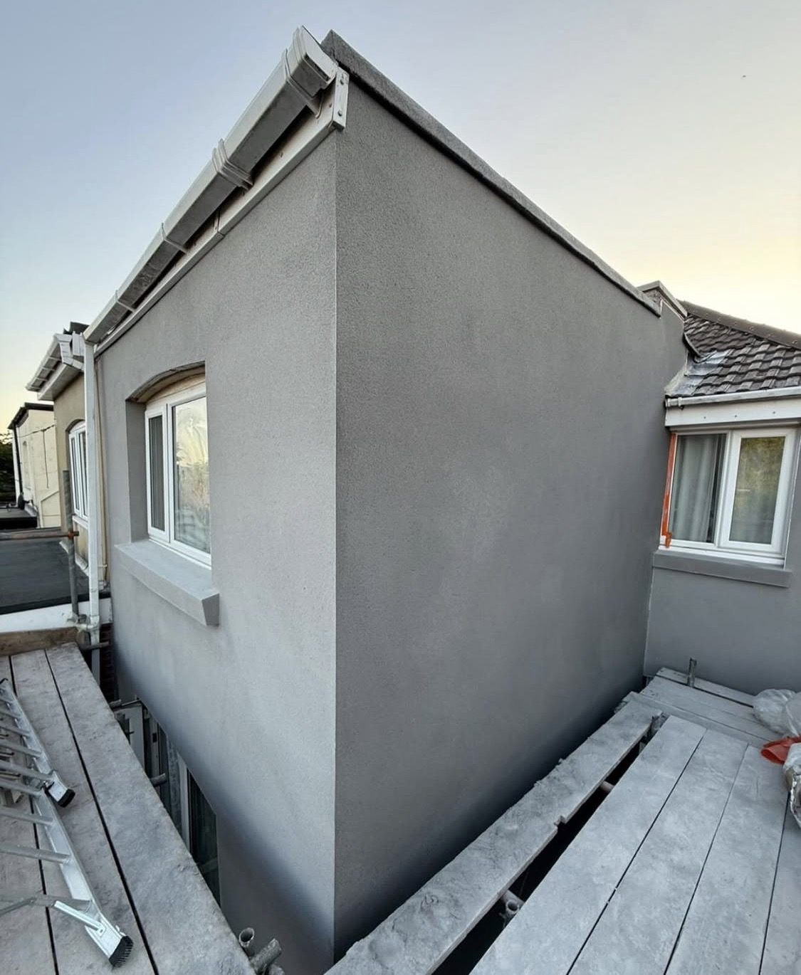 After: extension wrapped in a smooth, even grey render